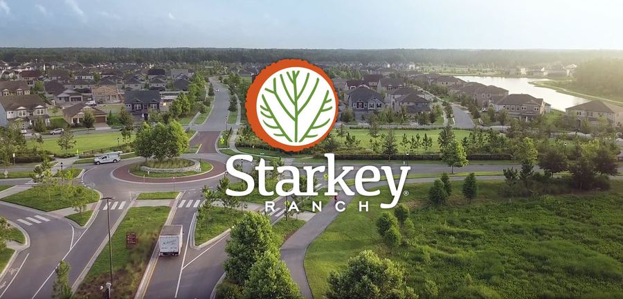Aerial view of the Starkey Ranch community — neighborhoods, roundabouts, lakes, and preserve.